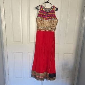 Colorful Sleeveless Red Suit with Gold Accents